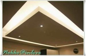 room with double layer roof with embedded led light system and spot light
