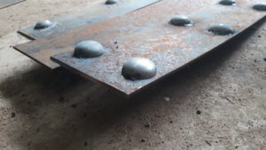rivets top of iron plates