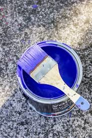 brush on a blue paint can