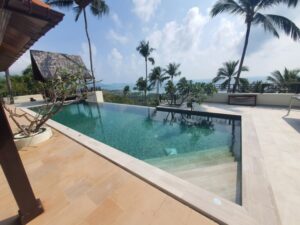 Villa construction in koh samui mountain. Turquise water in swimmin pool at Lamai beach view